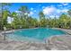 Resort-style pool with lounge chairs and covered seating area at 1001 Rivers Crossing St, Clermont, FL 34714