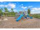 Community playground with playset and benches at 1001 Rivers Crossing St, Clermont, FL 34714