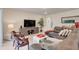 Comfortable living room featuring a sectional sofa and media console at 1001 Rivers Crossing St, Clermont, FL 34714