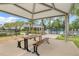 Community picnic area with table and grill at 1001 Rivers Crossing St, Clermont, FL 34714