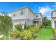 Two-story house with a two-car garage and nicely landscaped yard at 1001 Rivers Crossing St, Clermont, FL 34714
