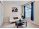 Cozy bedroom with a white futon and dark wood coffee table at 1001 Rivers Crossing St, Clermont, FL 34714