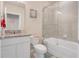 Clean bathroom with granite vanity, toilet, and tub shower combo at 1001 Rivers Crossing St, Clermont, FL 34714