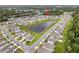 Aerial view of home and community with pond at 1001 Rivers Crossing St, Clermont, FL 34714