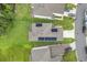 Aerial view of house with solar panels on the roof at 1001 Rivers Crossing St, Clermont, FL 34714