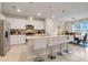 Modern kitchen with white cabinets, granite countertops, and island at 1001 Rivers Crossing St, Clermont, FL 34714