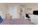 Upstairs bedroom with built-in desk and closet at 1001 Rivers Crossing St, Clermont, FL 34714