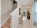Bright and spacious entryway with tile floors and staircase at 1001 Rivers Crossing St, Clermont, FL 34714