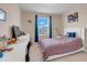 Well-lit bedroom with a comfortable bed, desk, and stylish decor at 1001 Rivers Crossing St, Clermont, FL 34714