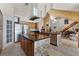 Open kitchen with two islands, stainless steel appliances, and tile flooring at 8605 Bay Shore Cv, Orlando, FL 32836