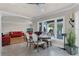Casual dining area with wooden table and chairs, overlooking the living room at 8605 Bay Shore Cv, Orlando, FL 32836