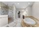 Elegant bathroom with soaking tub and walk-in shower at 8605 Bay Shore Cv, Orlando, FL 32836