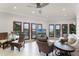 Gathering room with water views and access to balcony at 8605 Bay Shore Cv, Orlando, FL 32836