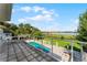 Private balcony overlooking pool, lake and lush landscape at 8605 Bay Shore Cv, Orlando, FL 32836