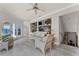 Living room with water views, comfy seating, and a large TV at 8605 Bay Shore Cv, Orlando, FL 32836