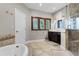 Bathroom with walk-in shower, soaking tub, and double vanity at 8605 Bay Shore Cv, Orlando, FL 32836