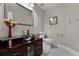 Modern bathroom with glass sink, dark wood vanity and tile flooring at 8605 Bay Shore Cv, Orlando, FL 32836