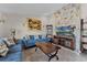 Relaxing living room with stone fireplace and comfortable seating at 8605 Bay Shore Cv, Orlando, FL 32836