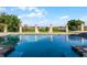 Expansive pool with columns and lake view at 8605 Bay Shore Cv, Orlando, FL 32836