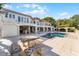 Resort-style pool and patio area with outdoor kitchen at 8605 Bay Shore Cv, Orlando, FL 32836