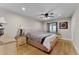 Bright bedroom with hardwood floors and a ceiling fan at 8605 Bay Shore Cv, Orlando, FL 32836