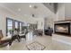 Bright Gathering room with fireplace, water views, and seating area at 8605 Bay Shore Cv, Orlando, FL 32836