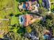 Bird's-eye view of a lakefront estate with pool and lush landscaping at 8605 Bay Shore Cv, Orlando, FL 32836