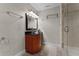 Clean bathroom with glass sink and shower at 8605 Bay Shore Cv, Orlando, FL 32836