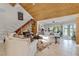 Living room with vaulted ceiling, and a view of the staircase at 8605 Bay Shore Cv, Orlando, FL 32836