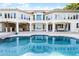 Luxury home with large pool, expansive patio, and waterfront views at 8605 Bay Shore Cv, Orlando, FL 32836