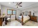 Bedroom with wooden bed frame and built-in desk at 8605 Bay Shore Cv, Orlando, FL 32836