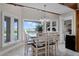 Bright dining area with water views and seating for six at 8605 Bay Shore Cv, Orlando, FL 32836