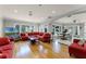 Open concept living area with red sofas and water views at 8605 Bay Shore Cv, Orlando, FL 32836