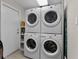 Convenient laundry room with two sets of stacked washer/dryer units at 8605 Bay Shore Cv, Orlando, FL 32836