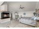 Large main bedroom with fireplace and elegant furnishings at 8605 Bay Shore Cv, Orlando, FL 32836