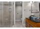 Modern bathroom with glass shower, vessel sink, and wood vanity at 8605 Bay Shore Cv, Orlando, FL 32836