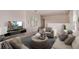 Spacious bonus room with comfortable seating and a large TV at 3579 Dahlia Dr, Lake Hamilton, FL 33851
