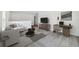Upstairs loft area with a couch, desk, and TV at 3579 Dahlia Dr, Lake Hamilton, FL 33851