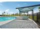 Pool area with shade structures and lounge chairs at 3579 Dahlia Dr, Lake Hamilton, FL 33851