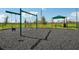 Playground with swings and shaded seating area at 3579 Dahlia Dr, Lake Hamilton, FL 33851
