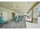 Covered patio with tables, chairs, and ceiling fans at 3579 Dahlia Dr, Lake Hamilton, FL 33851