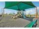 Shaded playground with slides, climbing structures, and swings at 3579 Dahlia Dr, Lake Hamilton, FL 33851