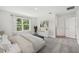 Bright bedroom with a bed, window, and access to a bathroom at 3579 Dahlia Dr, Lake Hamilton, FL 33851