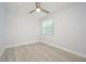 Spacious bedroom with ceiling fan and wood-look flooring at 511 Reed Ne Ave, Oviedo, FL 32765