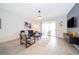 Bright and airy living room with comfortable seating and access to a patio at 8889 Cabot Cliffs Dr # 104, Davenport, FL 33896