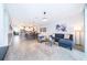 Spacious living area with an open floor plan and a view of the kitchen and dining area at 8889 Cabot Cliffs Dr # 104, Davenport, FL 33896
