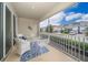 Relaxing screened porch with outdoor seating and neighborhood view at 8889 Cabot Cliffs Dr # 104, Davenport, FL 33896