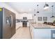 Sleek kitchen boasting stainless steel appliances and ample counter space at 8889 Cabot Cliffs Dr # 104, Davenport, FL 33896