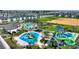 Aerial view of a community with water park featuring slides and a pool at 8889 Cabot Cliffs Dr # 104, Davenport, FL 33896