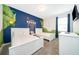 ' bedroom with two twin beds and a nautical-themed mural at 8889 Cabot Cliffs Dr # 104, Davenport, FL 33896